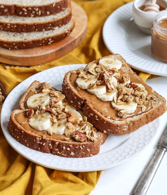Almond butter toast with banana slices and granola