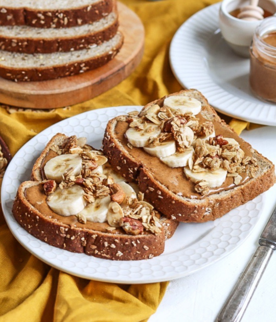 Almond butter toast with banana slices and granola