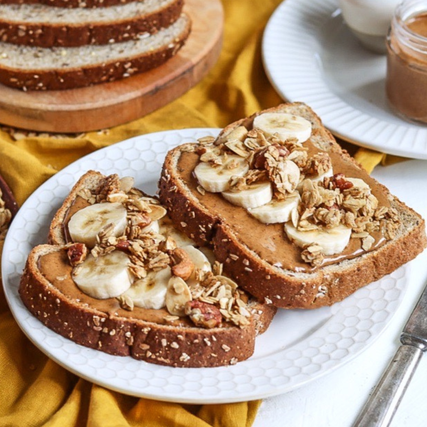 Almond butter toast with banana slices and granola
